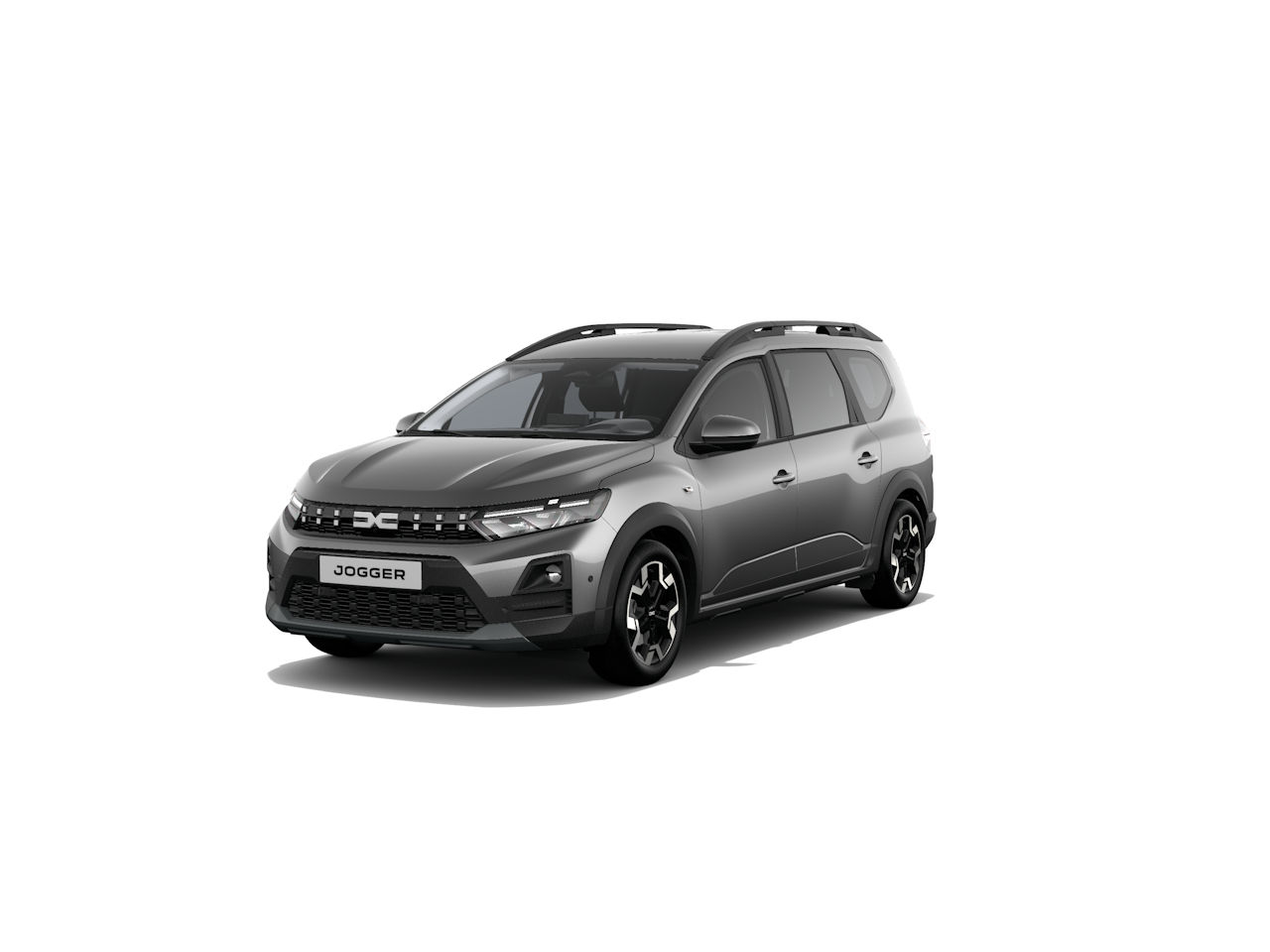 Ein grauer Dacia Jogger im Vordergrund, präsentiert von der Seite mit markantem Design und modernen Akzenten.