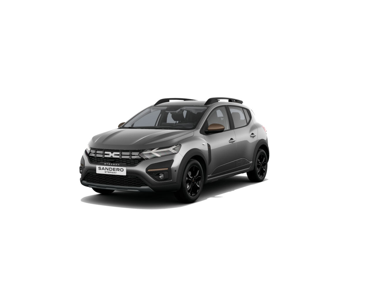 Dacia Sandero in Grau mit schwarzen Akzenten und Dachträgern, auf einem weißen Hintergrund.